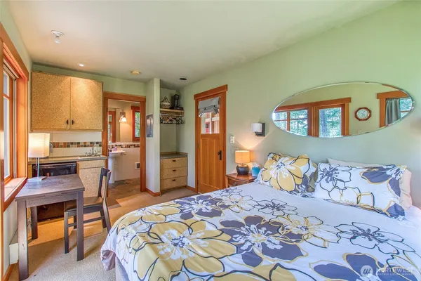 a kitchen with sink cabinets and stove