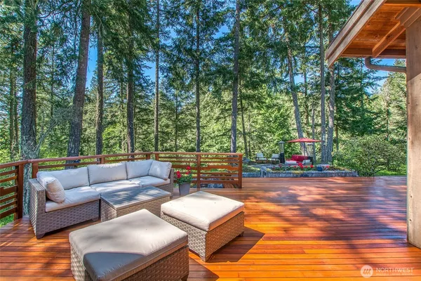 a backyard of a house with table and chairs