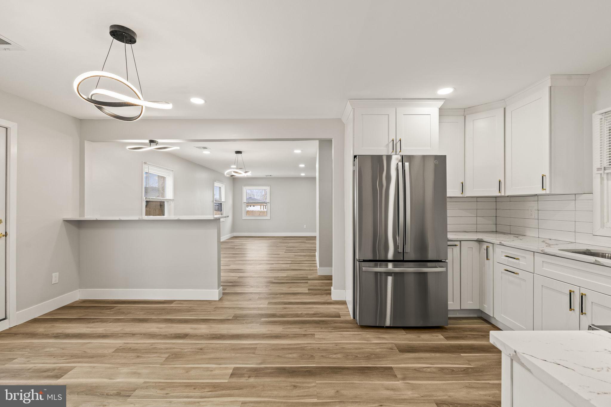 24 Pilgrim Lane Willingboro, NJ 08046 - Photo 14 of 40 a kitchen with stainless steel appliances granite countertop a refrigerator a stove and a sink