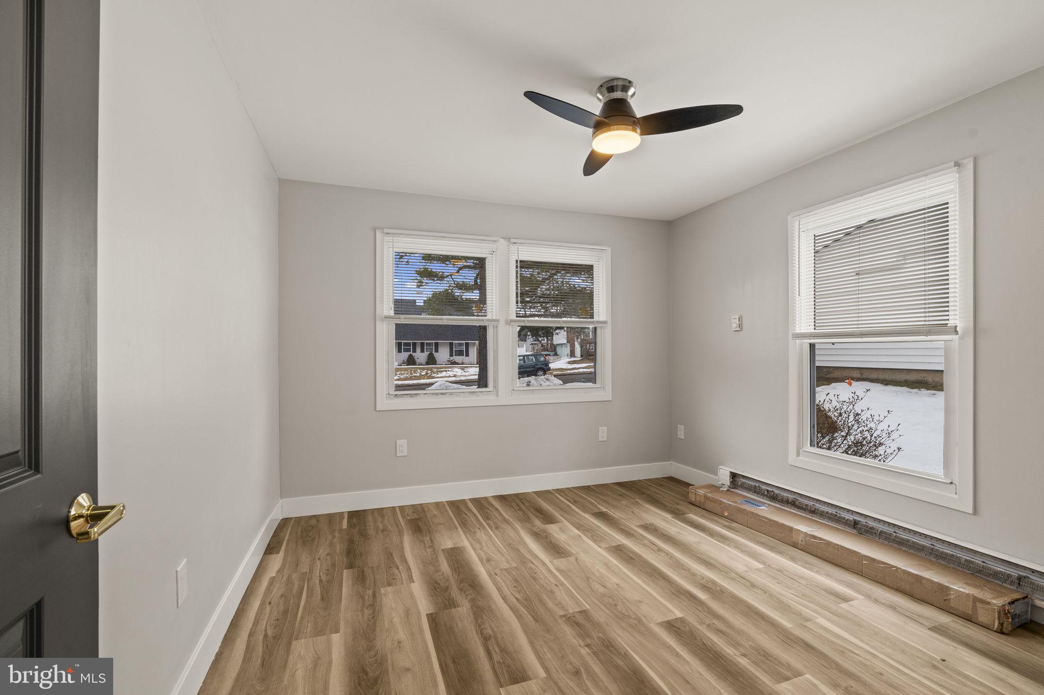 24 Pilgrim Lane Willingboro, NJ 08046 - Photo 23 of 40 wooden floor in an empty room with a window