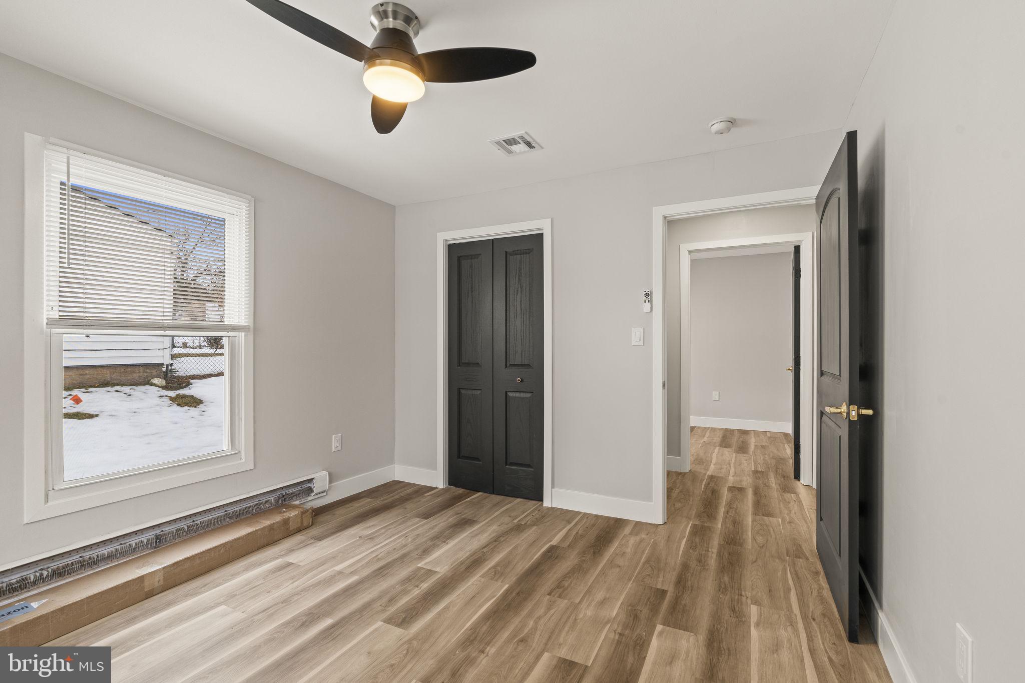 24 Pilgrim Lane Willingboro, NJ 08046 - Photo 24 of 40 a view of a room with wooden floor closet and windows
