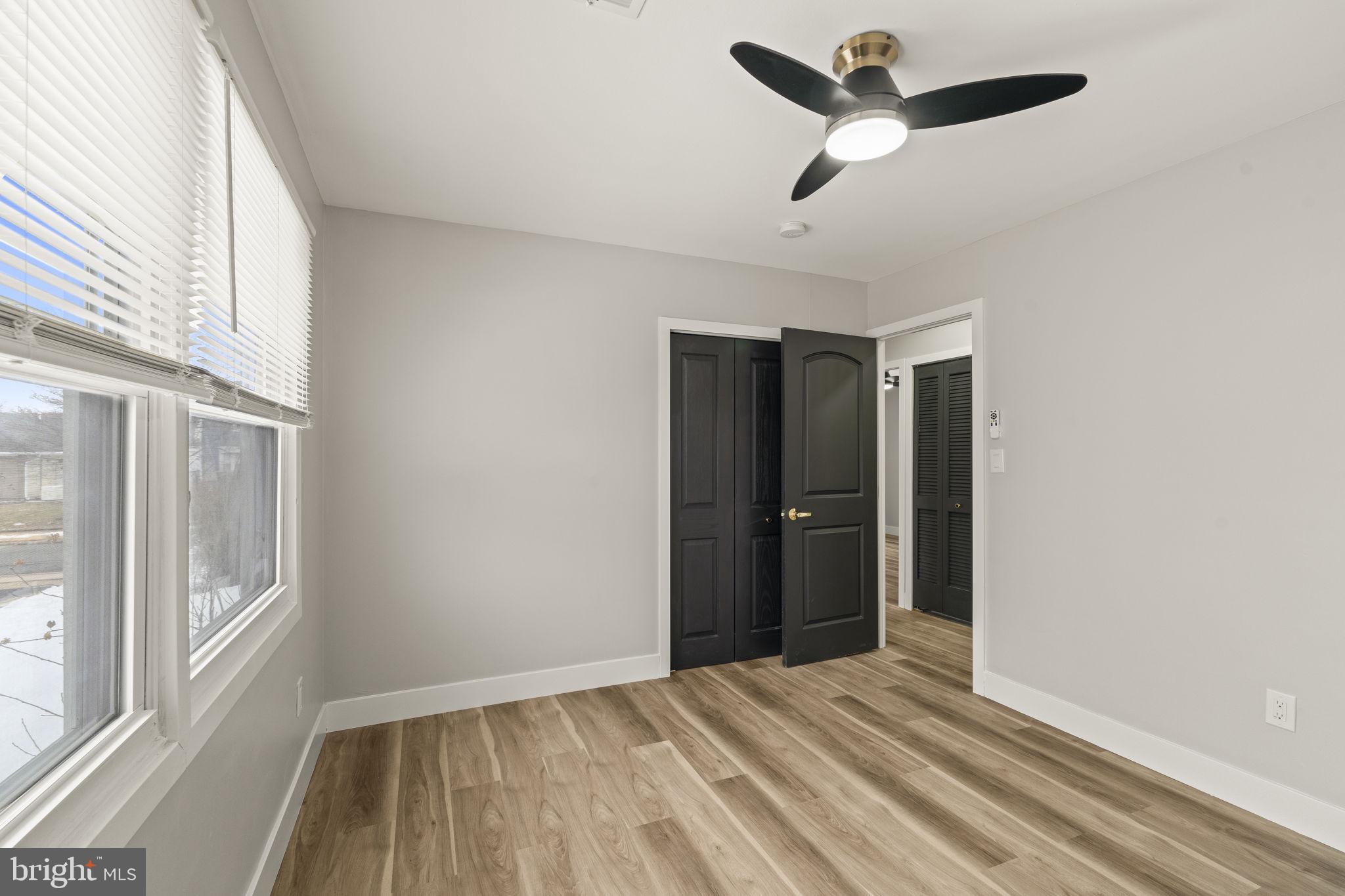 24 Pilgrim Lane Willingboro, NJ 08046 - Photo 30 of 40 a view of empty room with wooden floor and fan