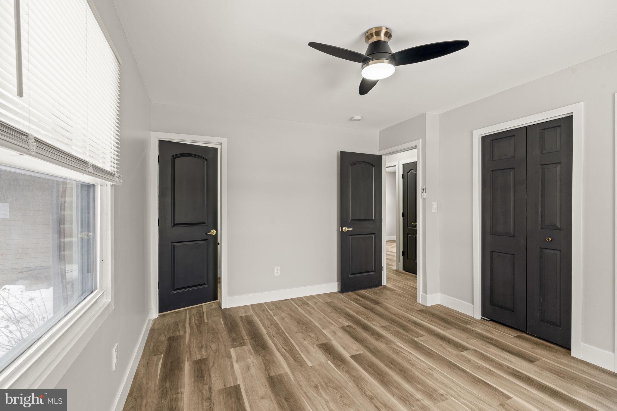 24 Pilgrim Lane Willingboro, NJ 08046 - Photo 36 of 40 a view of empty room with wooden floor and ceiling fan