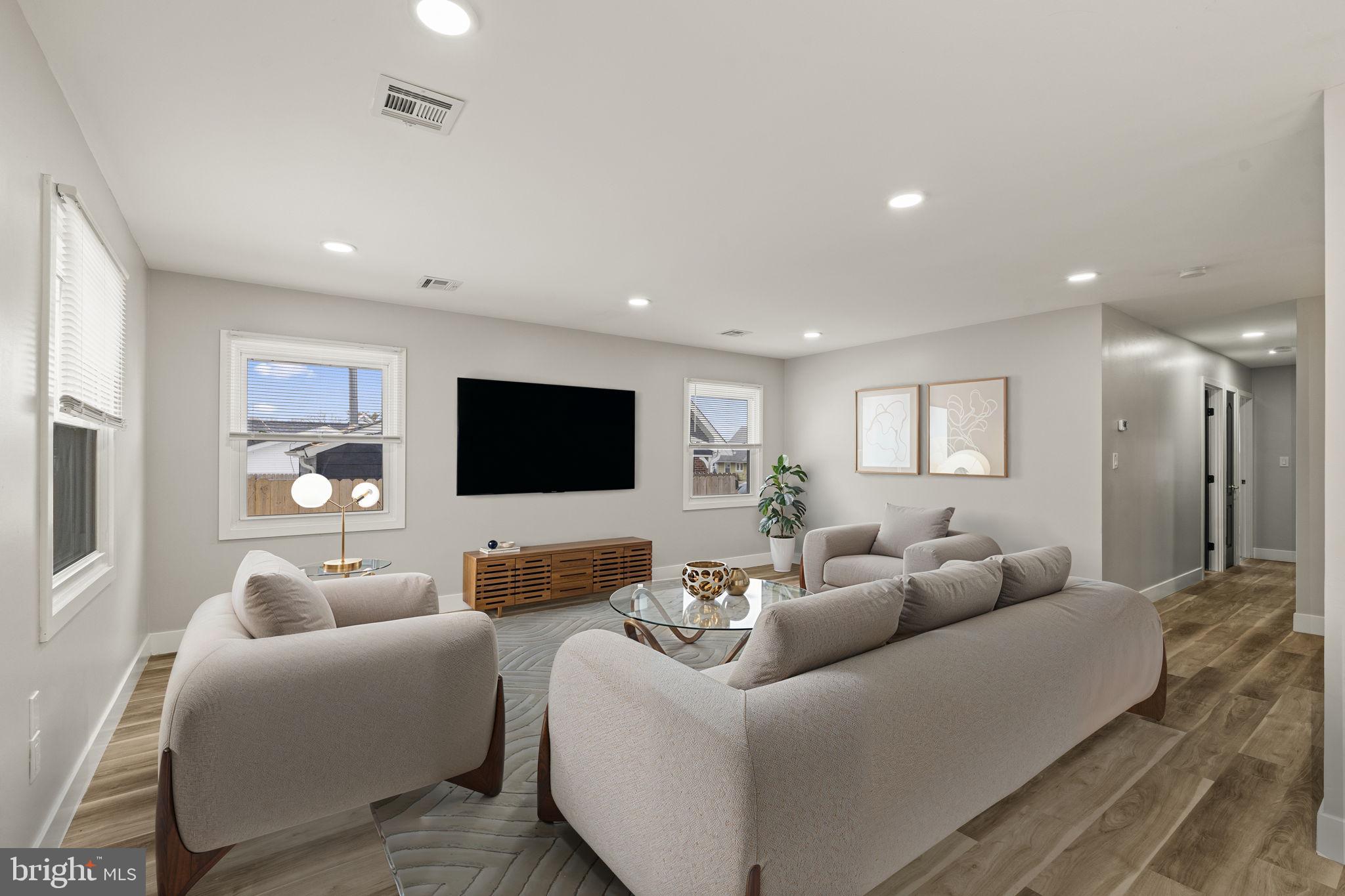 24 Pilgrim Lane Willingboro, NJ 08046 - Photo 5 of 40 a living room with furniture and a flat screen tv