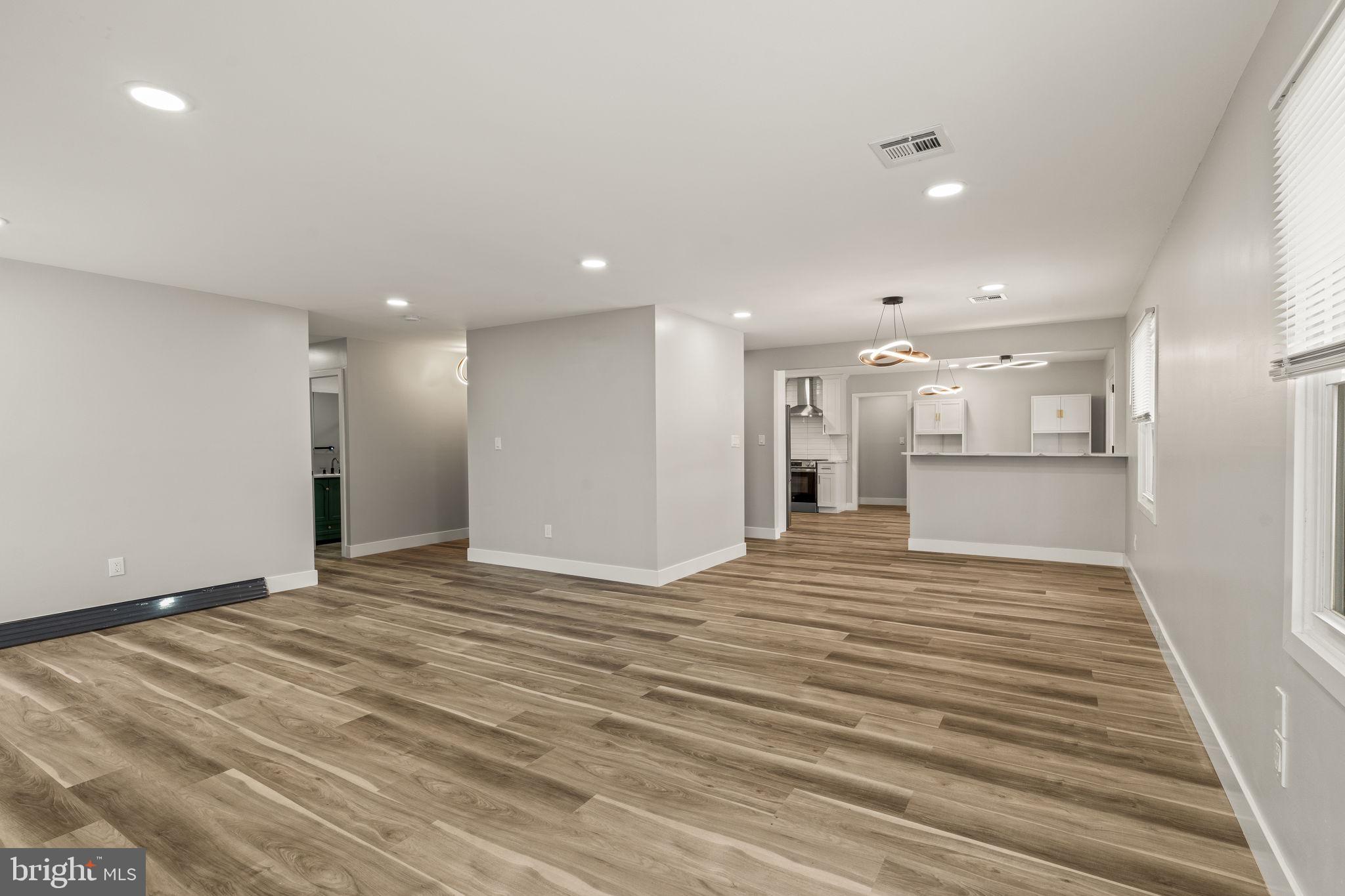 24 Pilgrim Lane Willingboro, NJ 08046 - Photo 8 of 40 a view of an empty room with wooden floor