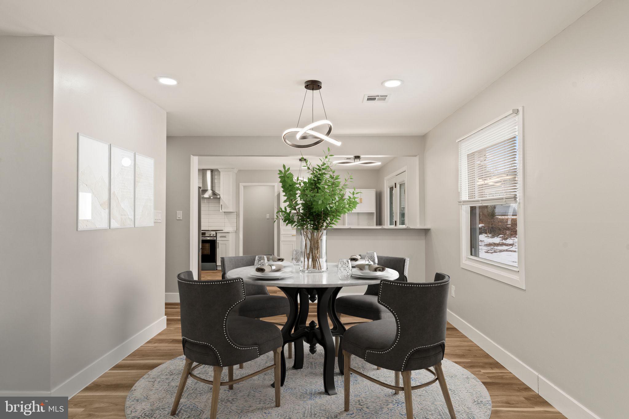24 Pilgrim Lane Willingboro, NJ 08046 - Photo 10 of 40 a view of a dining room with furniture and chandelier