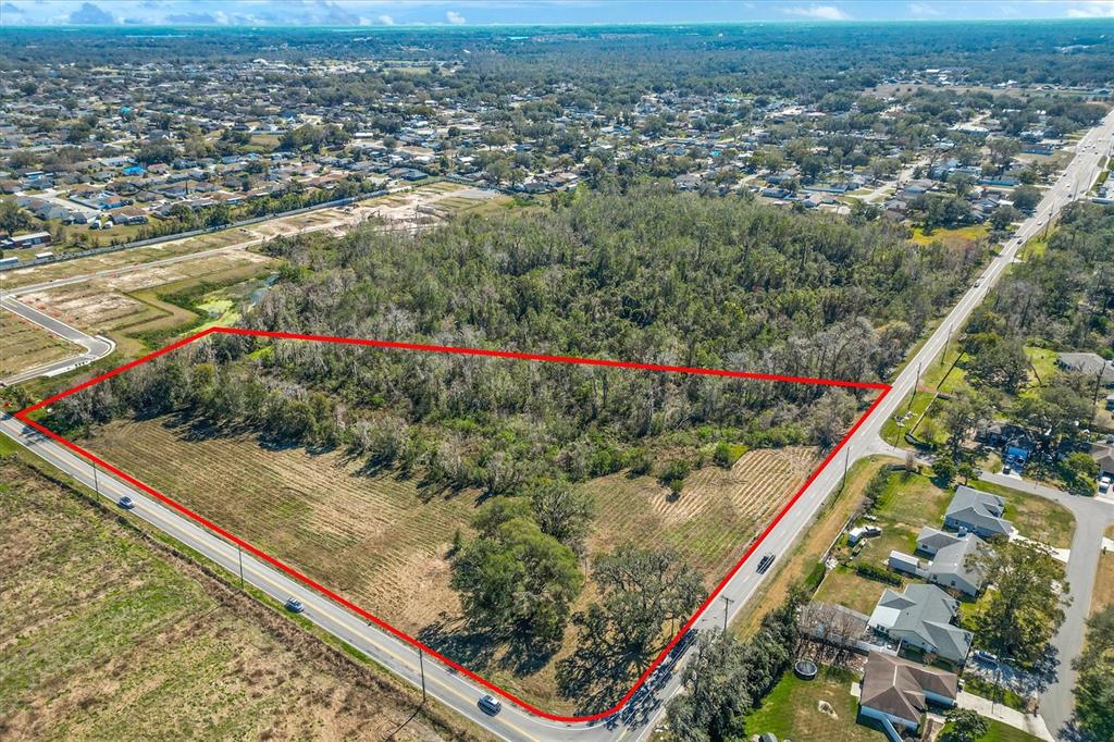 7835 Kathleen Road Lakeland, FL 33810 - Photo 2 of 10 an aerial view of residential houses with outdoor space