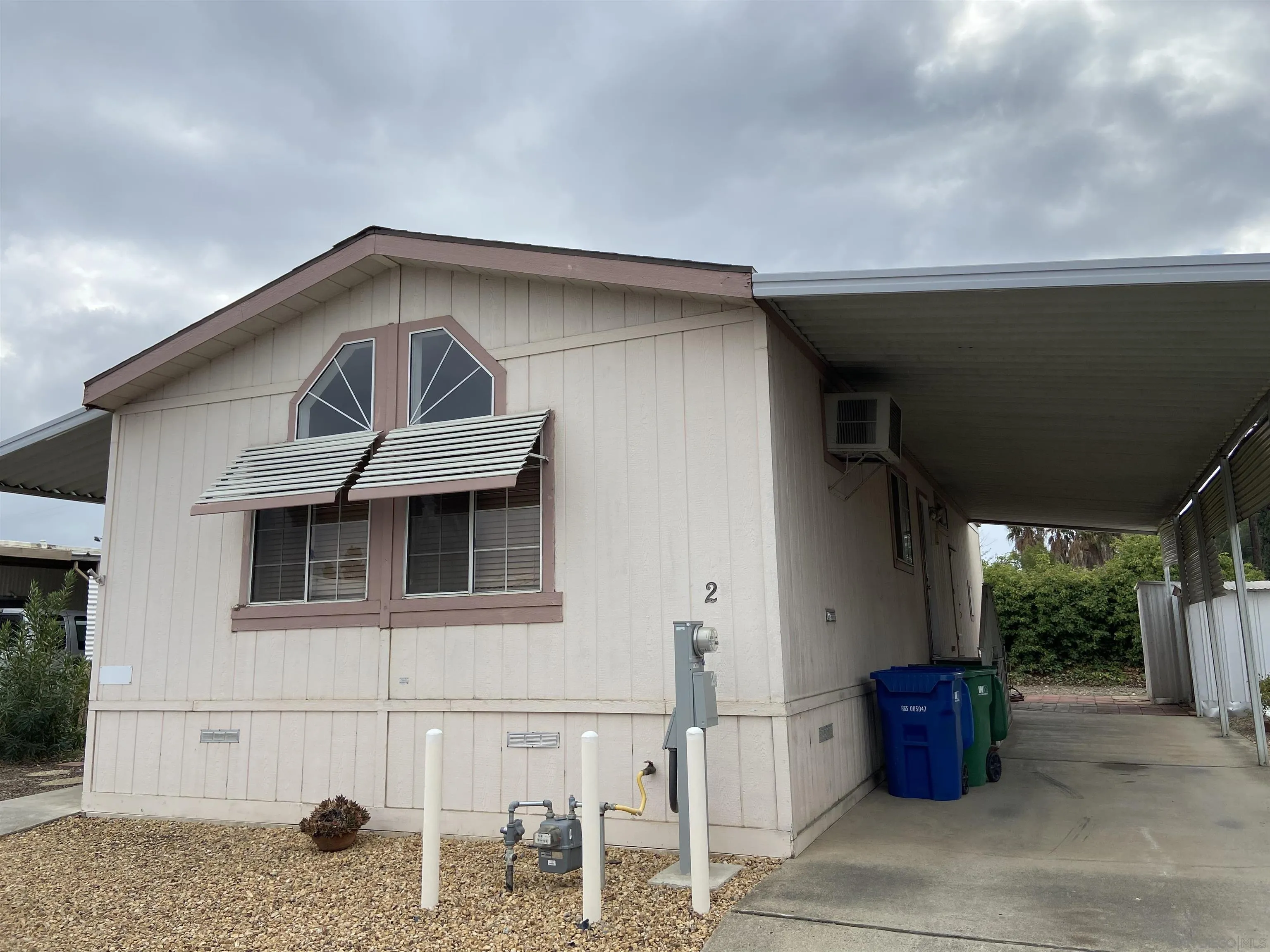 10000 Buena Vista Avenue, Unit 2 Santee, CA 92071 - Photo 1 of 12 a front view of a house with outdoor space
