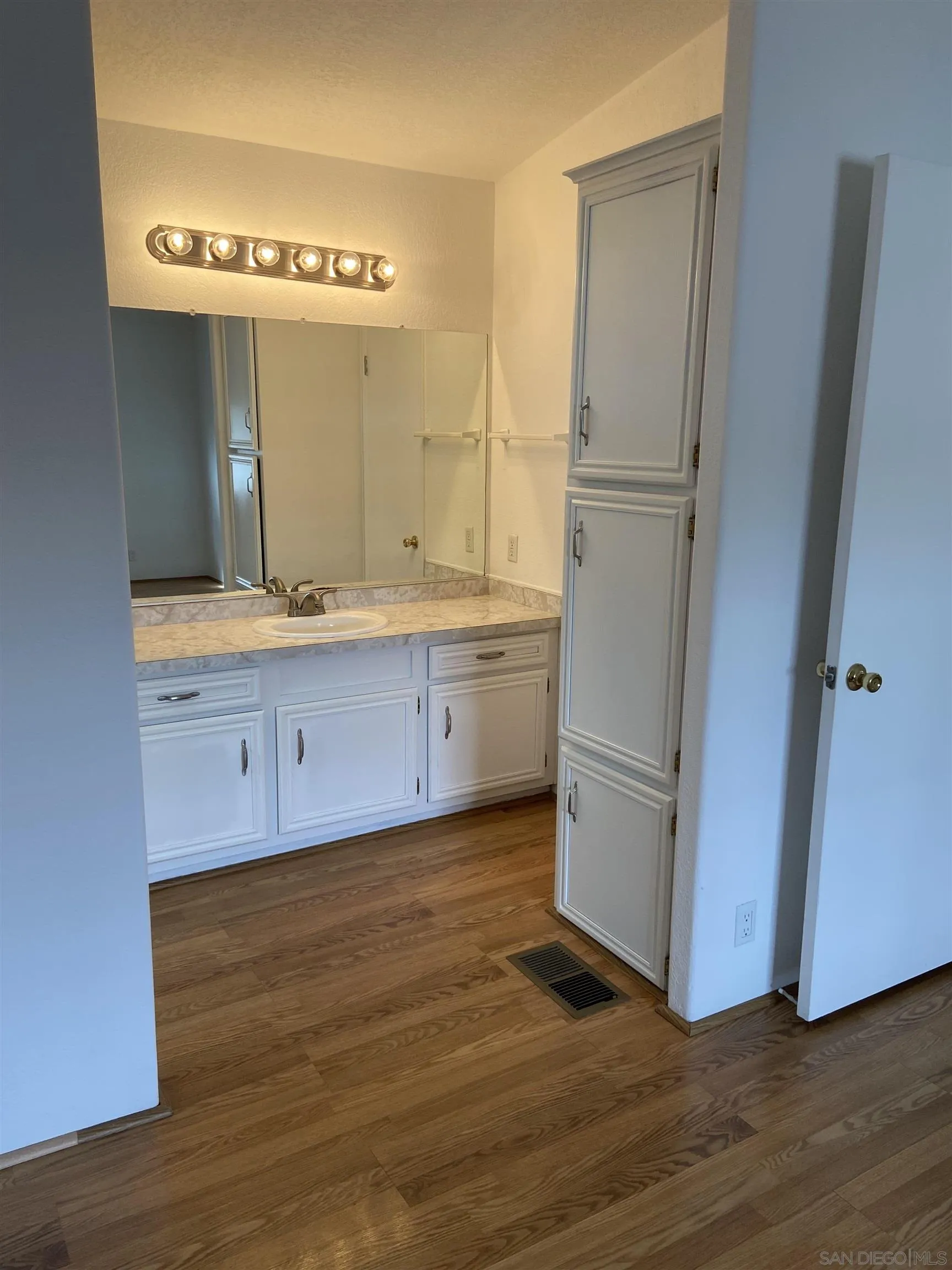 10000 Buena Vista Avenue, Unit 2 Santee, CA 92071 - Photo 7 of 12 a kitchen with a sink and a refrigerator