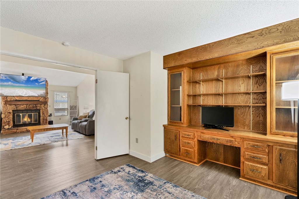 24800 Cornstalk Road Wildomar, CA 92595 - Photo 12 of 23 a view of living room with furniture and flat screen tv