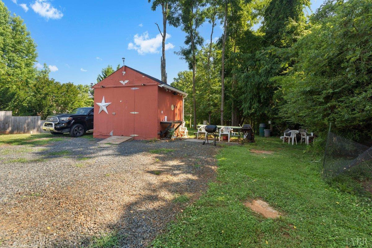 2608 Old Forest Road Lynchburg, VA 24501 - Photo 17 of 17 a backyard of a house with table and chairs
