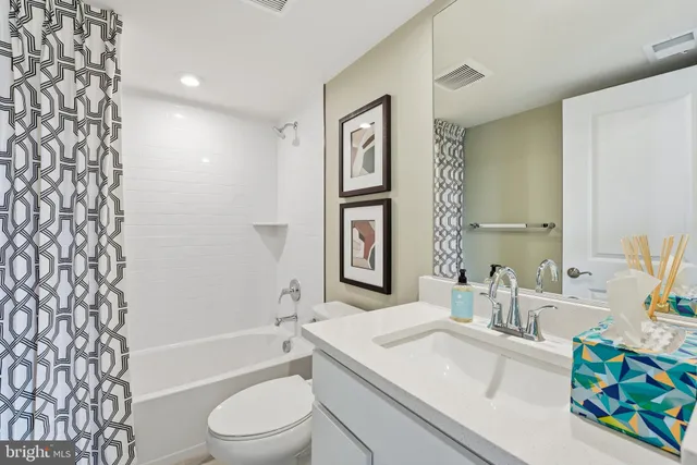 a bathroom with a sink a toilet and a bathtub