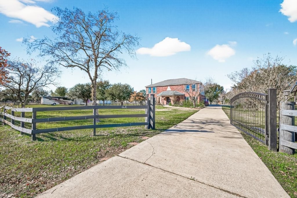 6610 Sprigg Street Fulshear, TX 77441 - Photo 1 of 49 a view of a park with large trees