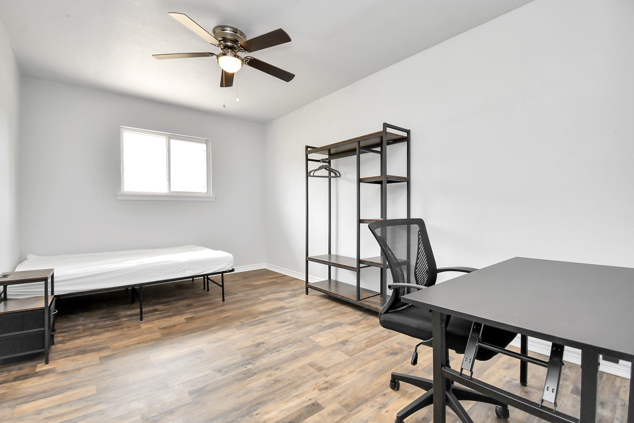 3743 Odin Court Houston, TX 77021 - Photo 30 of 36 Maintaining the home's signature bright and airy aesthetic, this flexible space adapts beautifully to a plush guest room, fitness studio, or a high-capacity corporate rental bedroom.