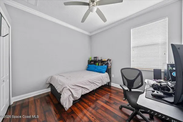 a bedroom with bed and a window