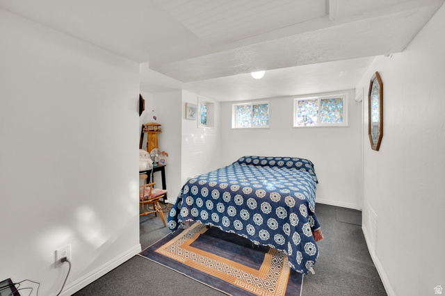 4635 Box Elder Street Murray, UT 84107 - Photo 13 of 21 Bedroom featuring dark carpet and baseboards