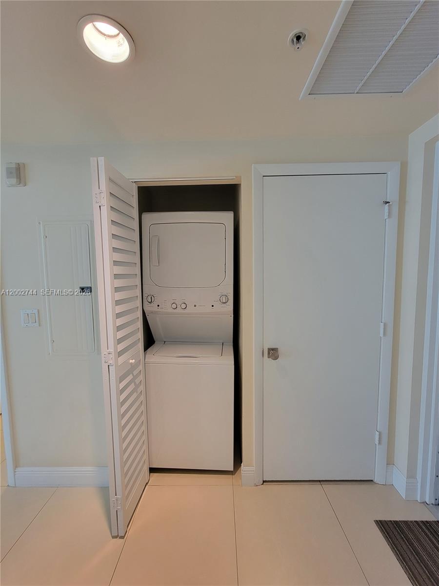 7290 Southwest 90th Street, Unit 403 Miami, FL 33156 - Photo 13 of 18 a utility room with a washer and dryer