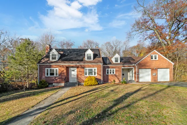 front view of a house with a yard