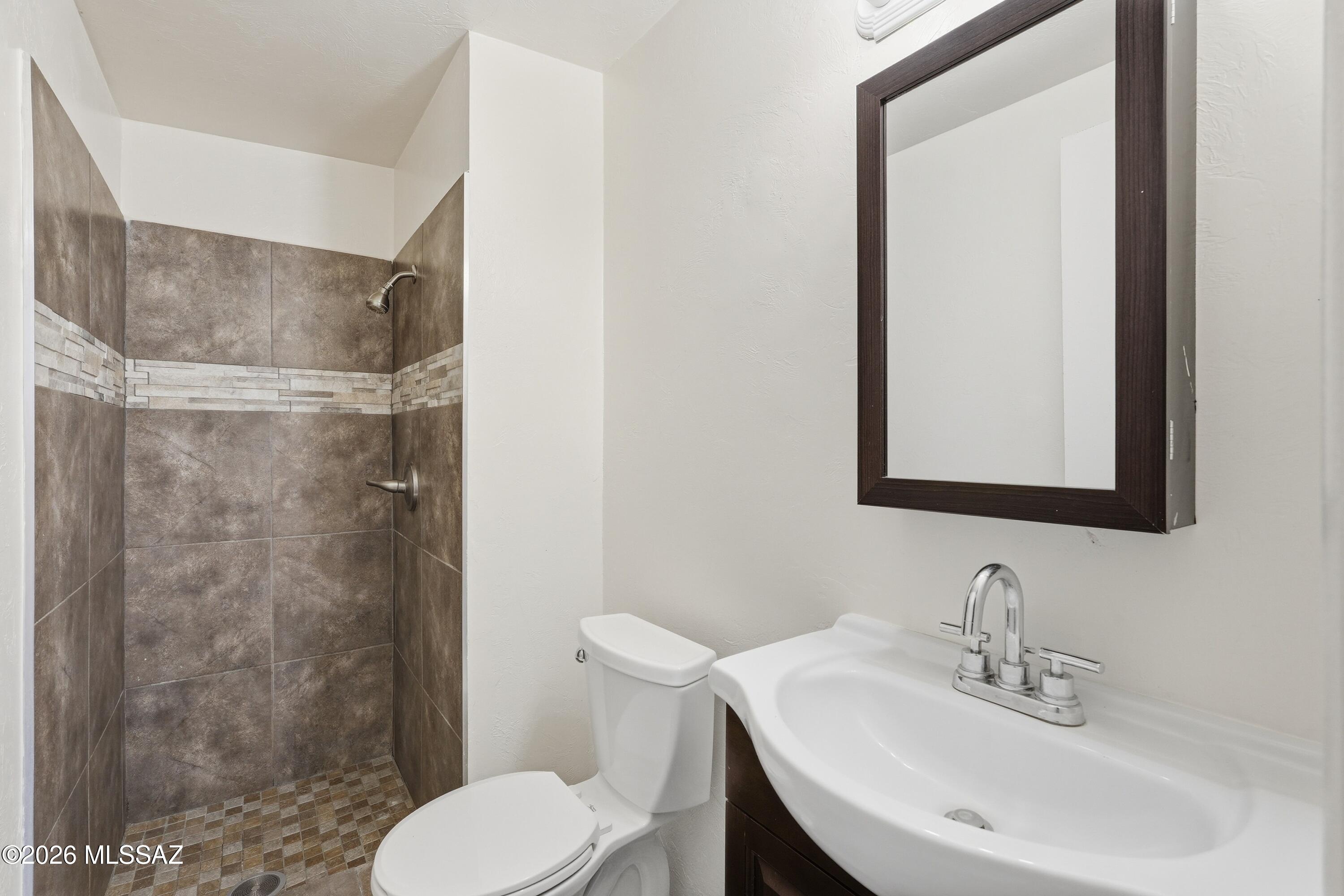 1808 West Caravelle Road Tucson, AZ 85713 - Photo 29 of 38 a bathroom with a sink toilet and shower