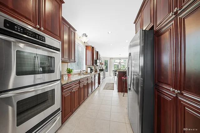 a kitchen with stainless steel appliances a stove and a refrigerator
