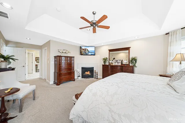 a bed room with a bed and a fireplace