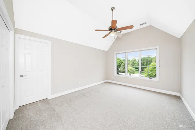 a view of room with a ceiling fan