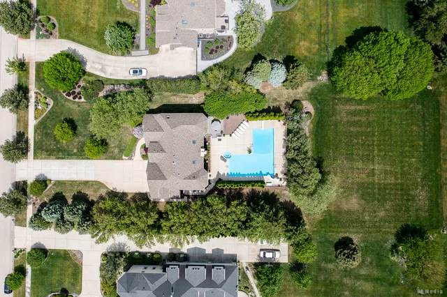 an aerial view of a house with a yard