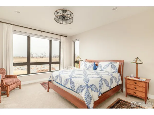 a dining room with furniture a rug and wooden floor