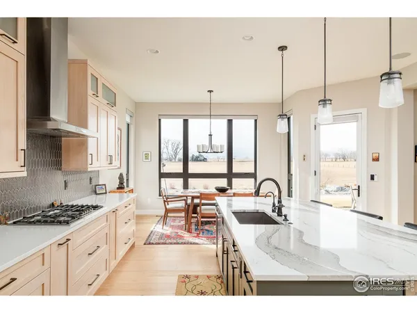 a kitchen with a sink cabinets and window