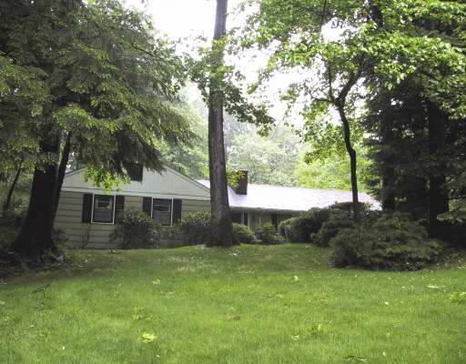223 Foxwood Road Stamford, CT 06903 - Photo 1 of 1 a view of house with backyard and trees