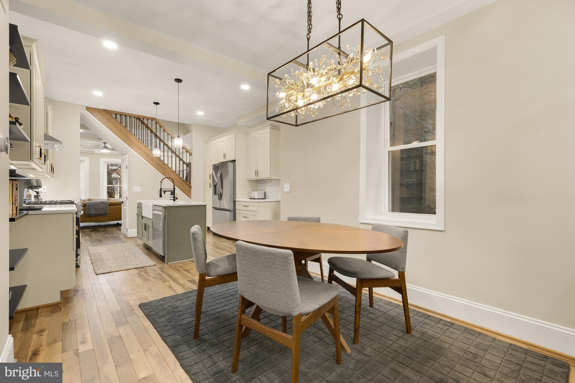 2208 East Baltimore Street Baltimore, MD 21231 - Photo 13 of 46 a view of a dining room with furniture and a chandelier