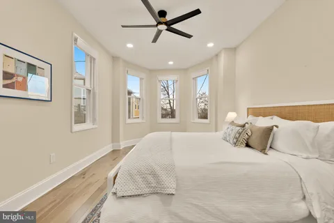 a bedroom with a large bed and a window