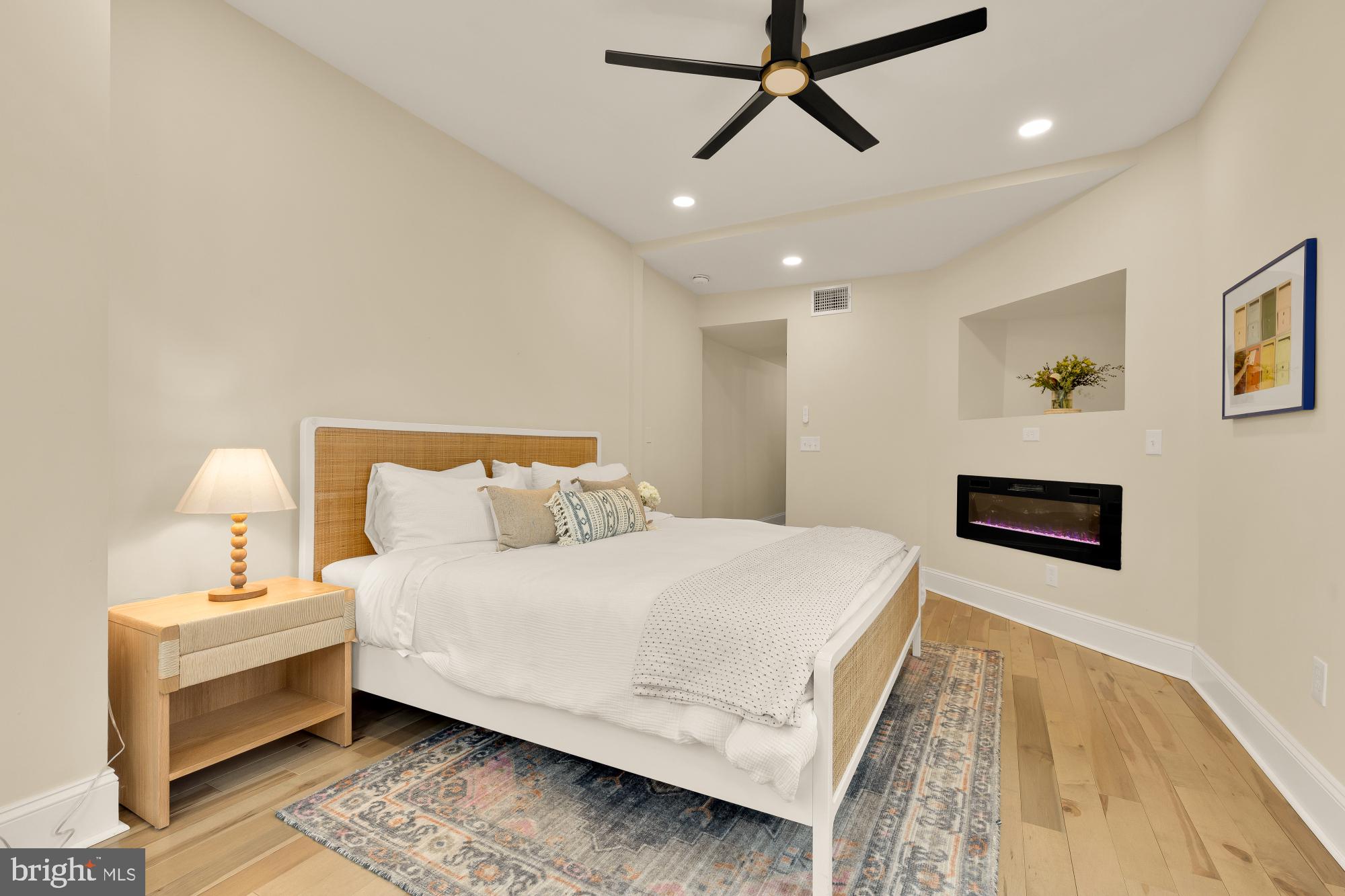 2208 East Baltimore Street Baltimore, MD 21231 - Photo 29 of 46 a bedroom with a bed and a ceiling fan