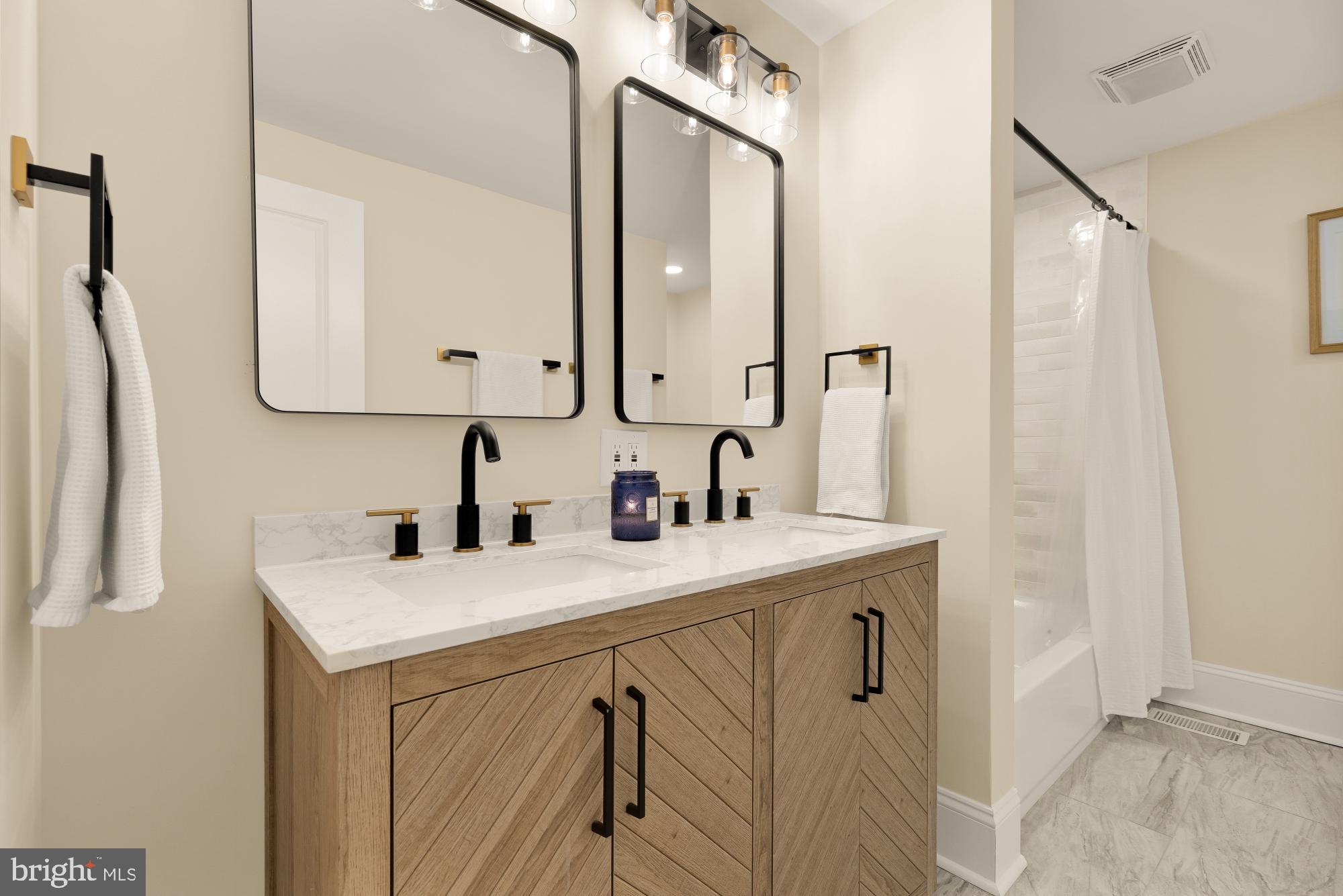 2208 East Baltimore Street Baltimore, MD 21231 - Photo 30 of 46 a bathroom with a sink vanity and a mirror