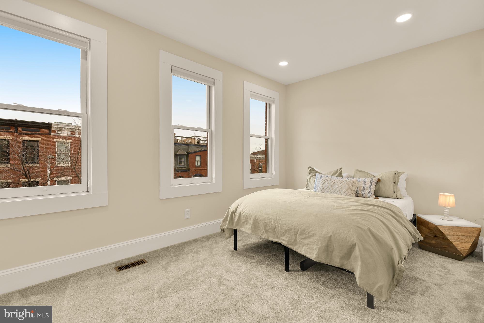 2208 East Baltimore Street Baltimore, MD 21231 - Photo 34 of 46 a bedroom with a bed and window