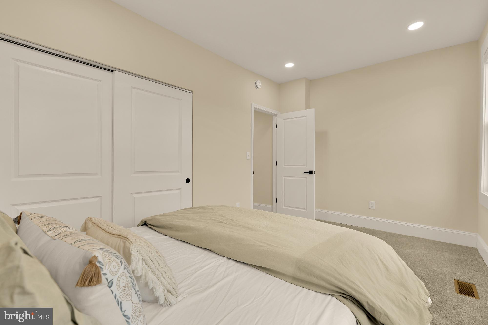 2208 East Baltimore Street Baltimore, MD 21231 - Photo 35 of 46 a bedroom with a bed and a shower