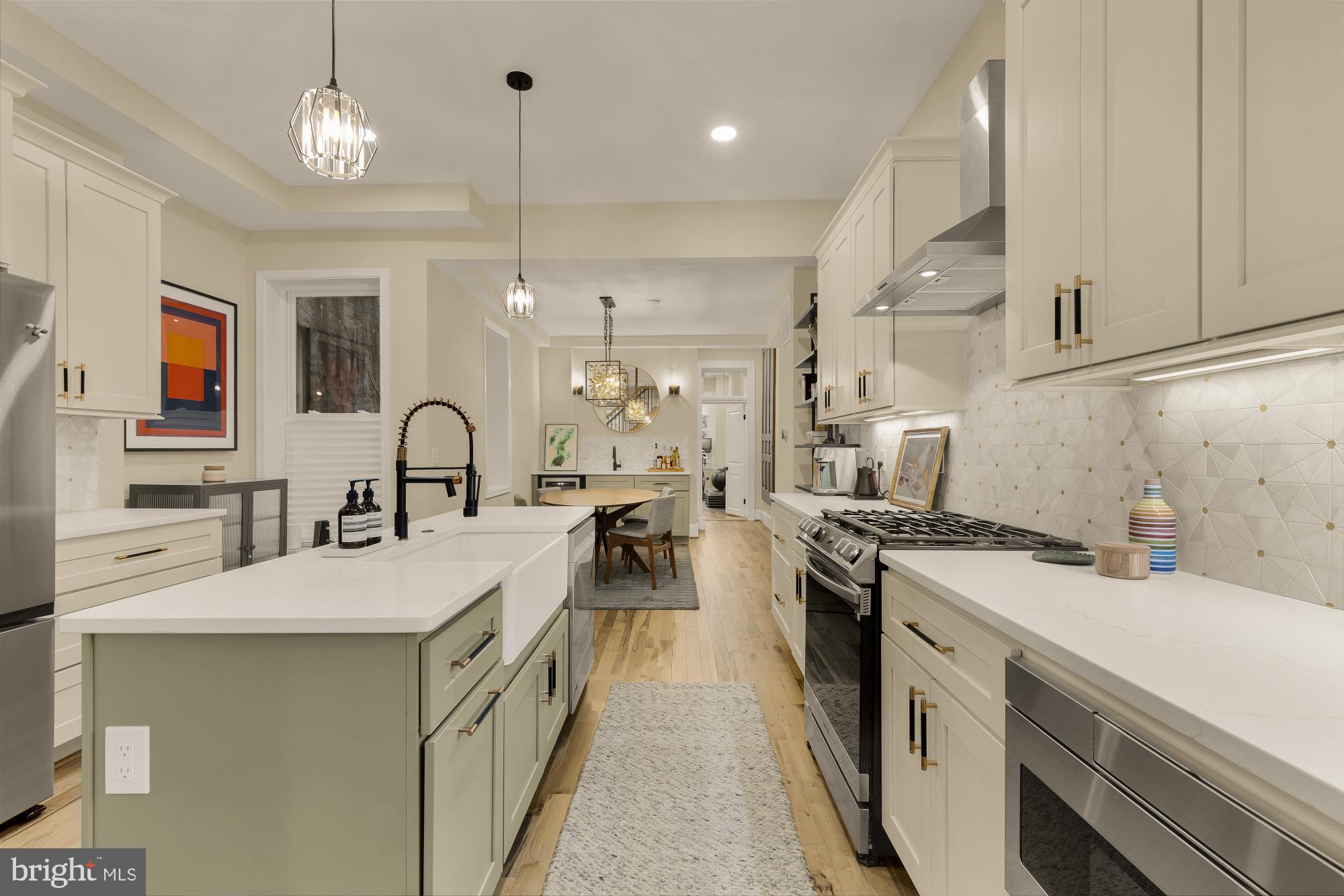 2208 East Baltimore Street Baltimore, MD 21231 - Photo 8 of 46 a kitchen with a sink stove and cabinets