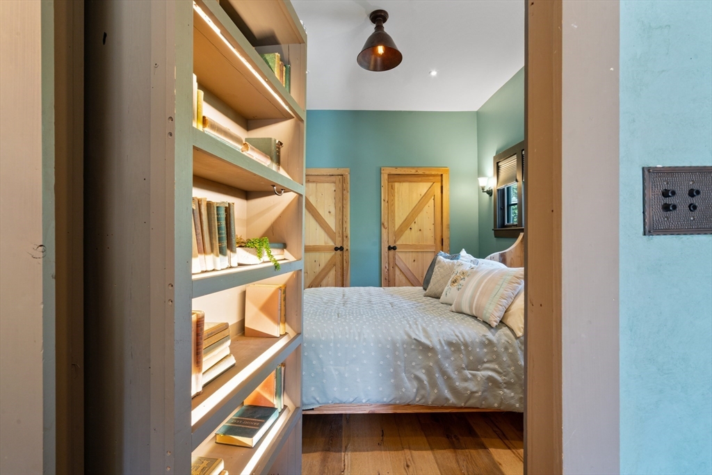 7 Brewer Street, Unit 1 Boston, MA 02130 - Photo 12 of 15 a bedroom with furniture and a large window