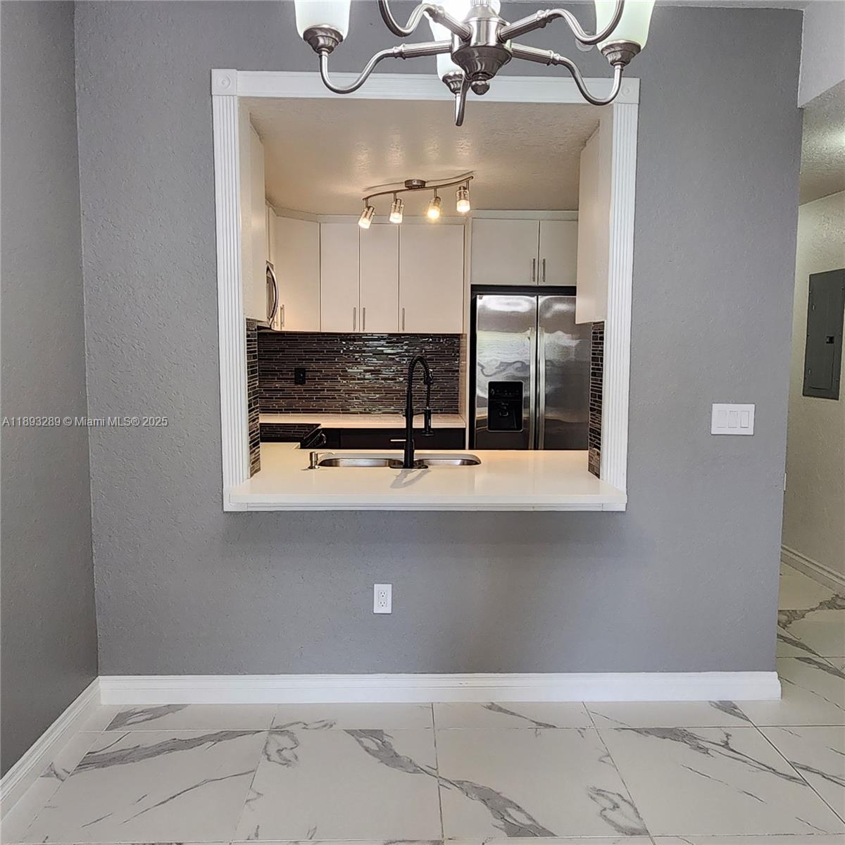 2941 Riverside Drive, Unit 102 Coral Springs, FL 33065 - Photo 12 of 37 a view of a bathroom with a sink and mirror