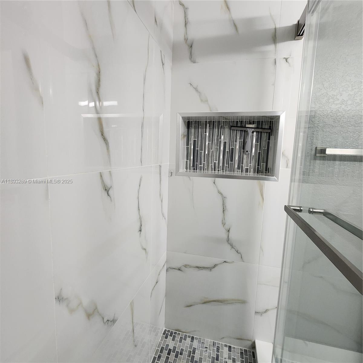 2941 Riverside Drive, Unit 102 Coral Springs, FL 33065 - Photo 17 of 37 a bathroom with a shower