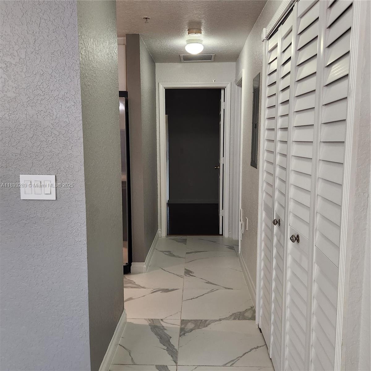 2941 Riverside Drive, Unit 102 Coral Springs, FL 33065 - Photo 19 of 37 a view of a hallway with a elevator