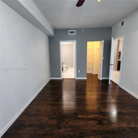 a view of a livingroom with wooden floor