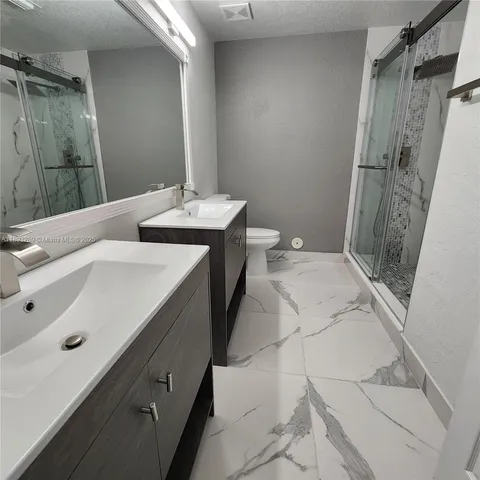 a bathroom with a sink and mirror
