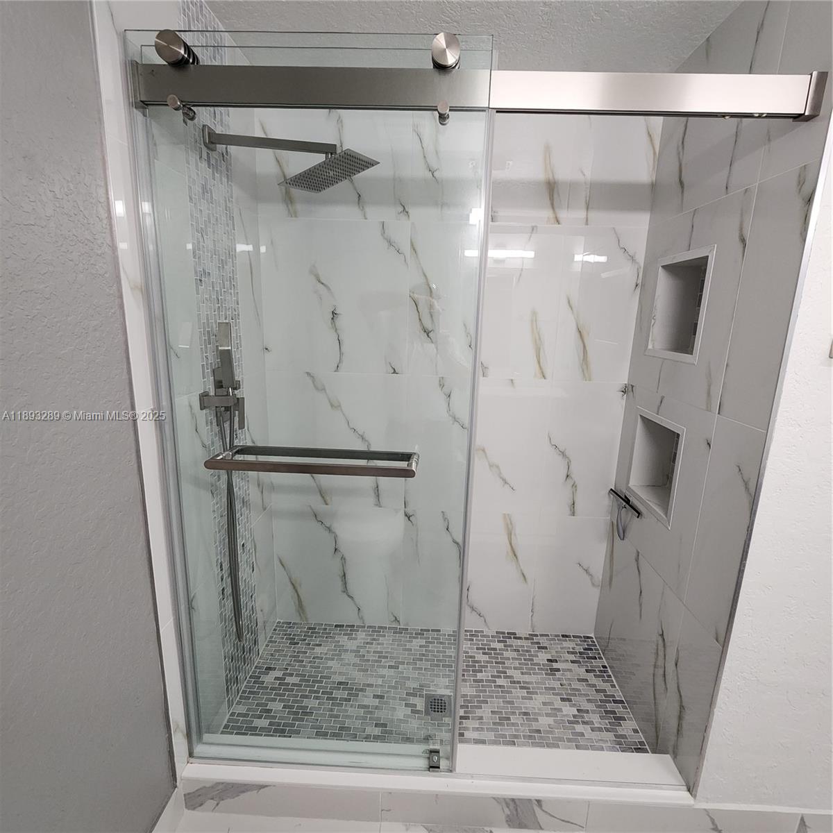 2941 Riverside Drive, Unit 102 Coral Springs, FL 33065 - Photo 27 of 37 a bathroom with a shower