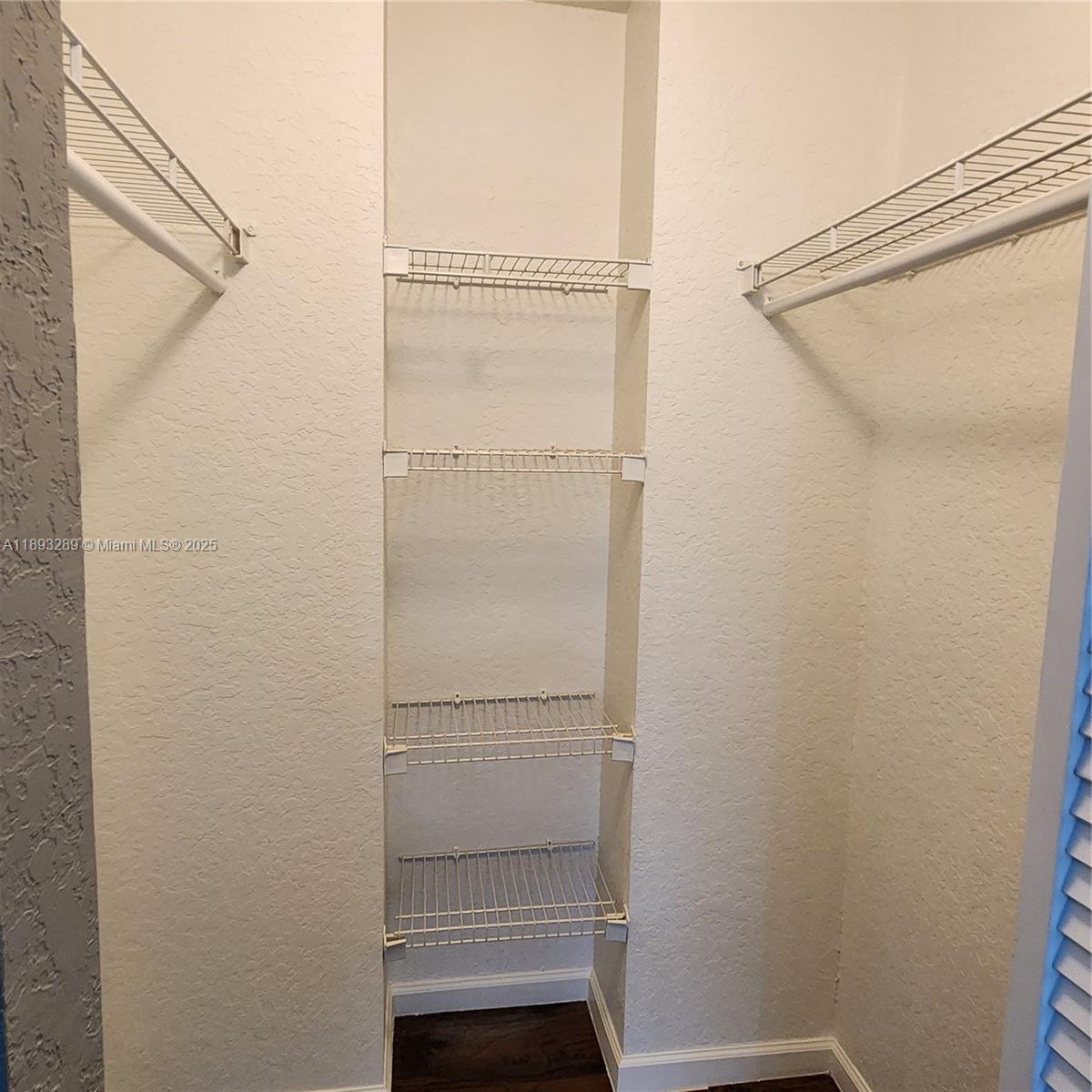 2941 Riverside Drive, Unit 102 Coral Springs, FL 33065 - Photo 29 of 37 a view of walk in closet with empty racks