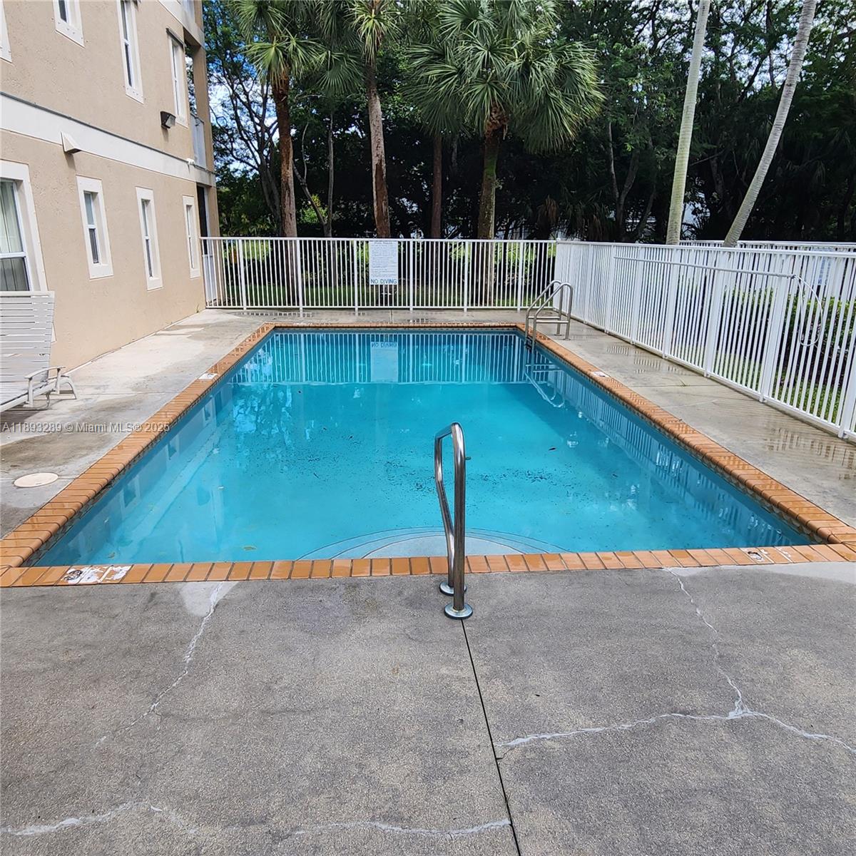2941 Riverside Drive, Unit 102 Coral Springs, FL 33065 - Photo 5 of 37 a view of swimming pool with a patio