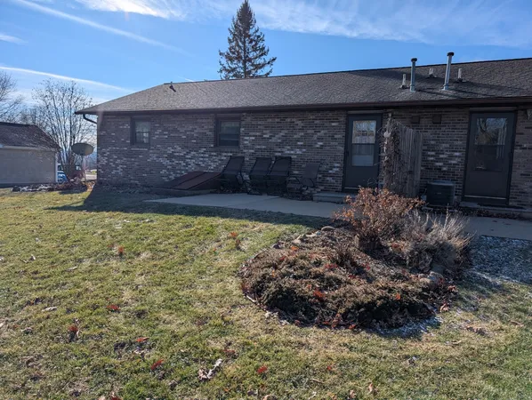a view of a backyard of the house