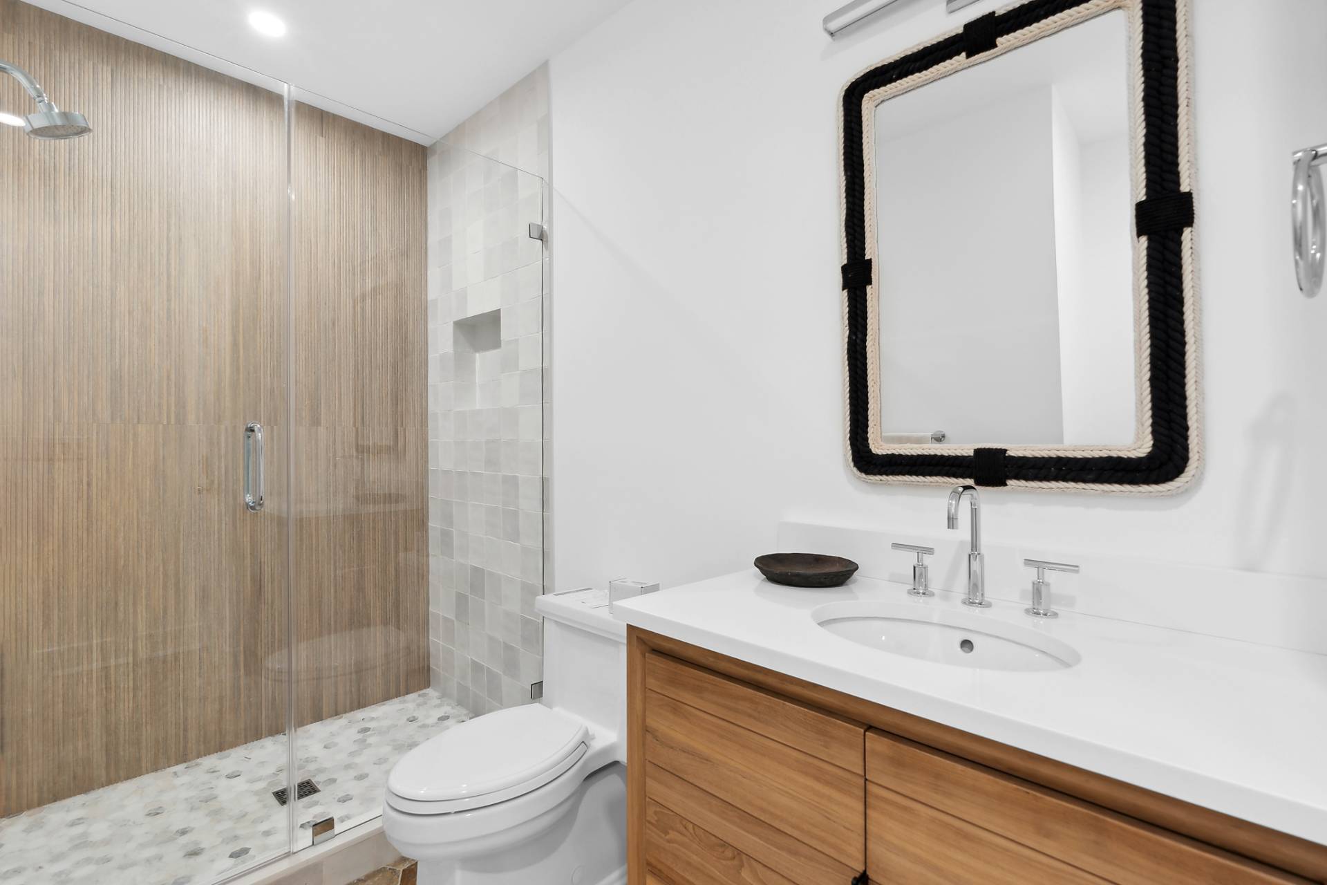 55 Fairview Avenue Montauk, NY 11954 - Photo 17 of 22 a bathroom with a sink a toilet and shower