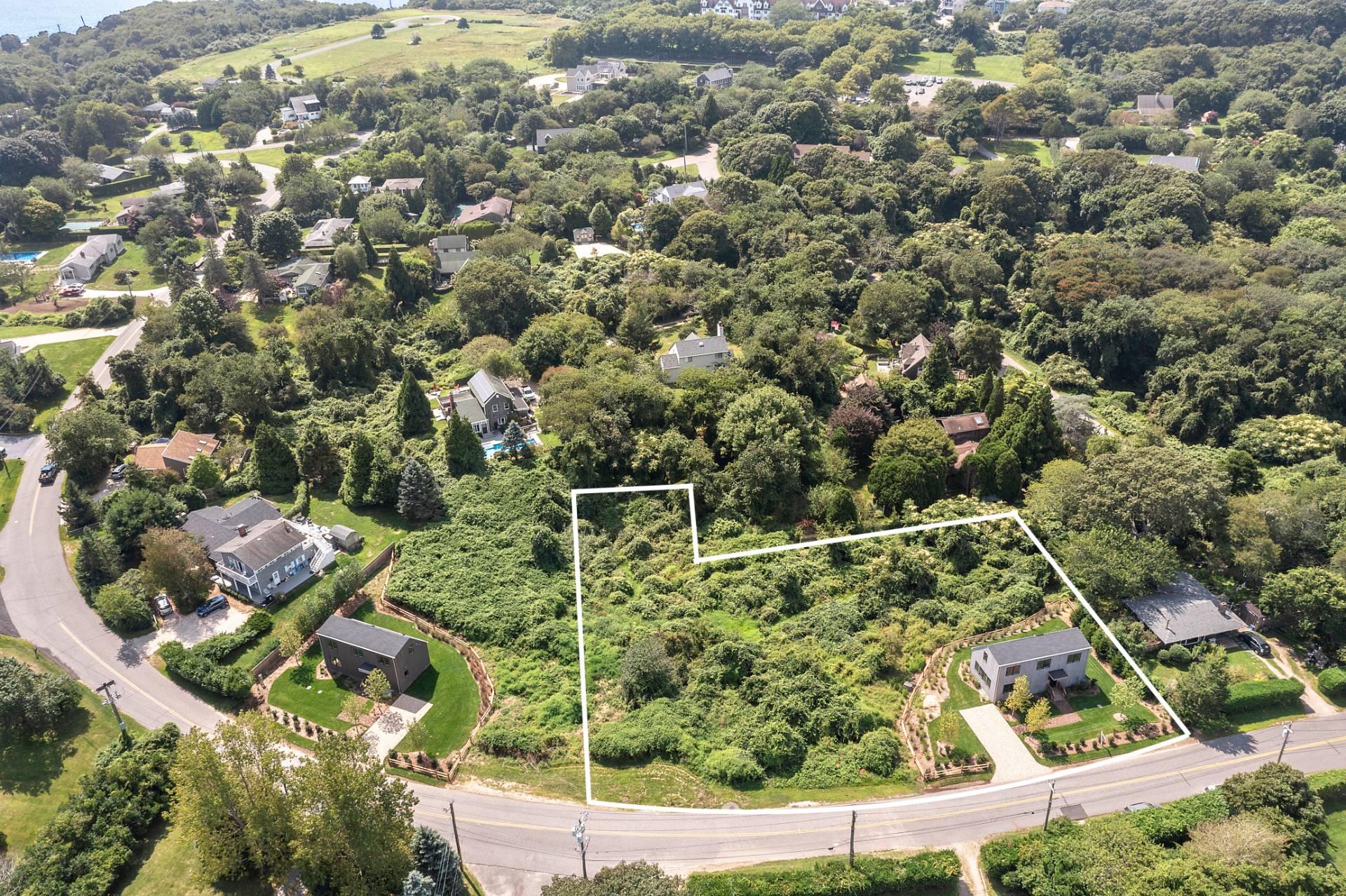 55 Fairview Avenue Montauk, NY 11954 - Photo 20 of 22 an aerial view of residential houses with outdoor space and trees