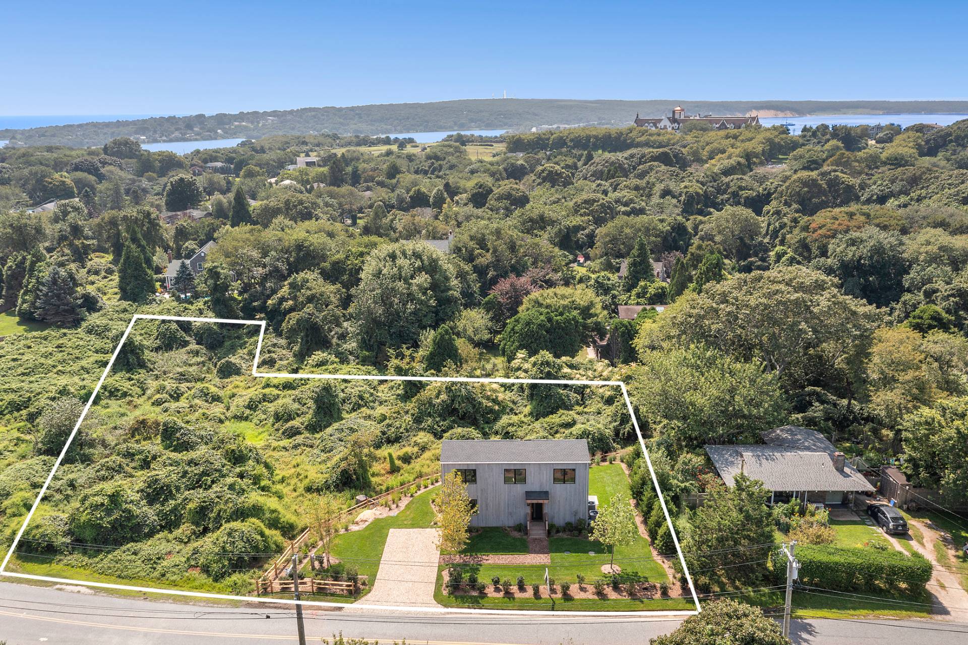 55 Fairview Avenue Montauk, NY 11954 - Photo 2 of 22 an aerial view of a house with a yard